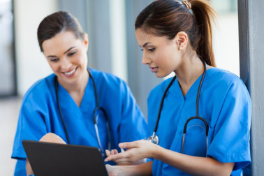 healthcare workers using laptop